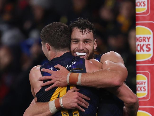 ADELAIDE, AUSTRALIA - JULY 13: Jordon Butts and Riley Thilthorpe of the Crows celebrate their win during the 2024 AFL Round 18 match between the Adelaide Crows and the St Kilda Saints at Adelaide Oval on July 13, 2024 in Adelaide, Australia. (Photo by James Elsby/AFL Photos via Getty Images)