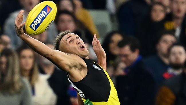 MELBOURNE, AUSTRALIA - APRIL 30: Shai Bolton of the Tigers attempts to mark during the round seven AFL match between the Richmond Tigers and the Western Bulldogs at Melbourne Cricket Ground on April 30, 2021 in Melbourne, Australia. (Photo by Quinn Rooney/Getty Images)