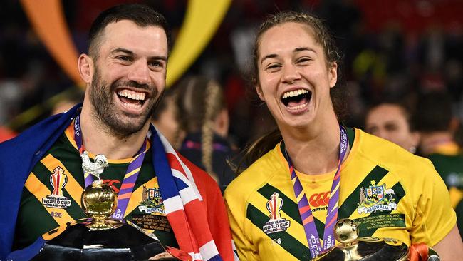 James Tedesco and Kezie Apps hold their respective World Cup trophies after victories in 2022. Picture: Oli Scarff / AFP