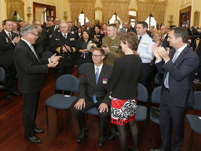 Dr Richard Harris receives a standing ovation for his role in the Thailand cave rescue at Government House during a reception by Governor Hieu Van Le. Picture: Bryan Charlton /Government House Adelaide