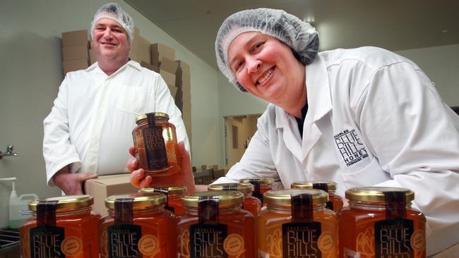 Robert and Nicola (front) Charles of Blue Hills Honey at Mawbanna . Picture: File