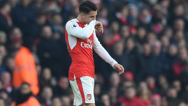 Granit Xhaka of Arsenal walks off the pitch after being shown a red card.