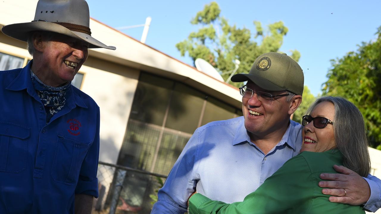 Scott Morrison hugs farmer Jacqueline Curley during his first visit since winning the election. Picture: Lukas Coch/AAP Image