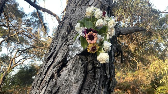 Flowers left at the scene on Campbell St in Wonthaggi where the 68-year-old woman was killed after she was allegedly hit by a car. Picture: Jack Colantuono