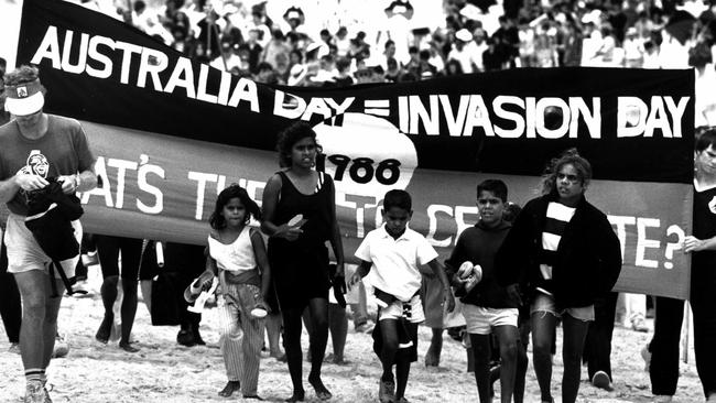 Protesters at Frenchmans Bay, La Perouse for the First Fleet re-enactment carry banners "Australia Day = Invasion Day" in 1988. Picture: Michael Jones