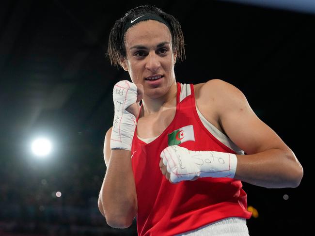Algeria's Imane Khelif poses after defeating China's Yang Liu to win gold in their women's 66 kg final boxing match at the 2024 Summer Olympics, Friday, Aug. 9, 2024, in Paris, France. (AP Photo/Ariana Cubillos, File)
