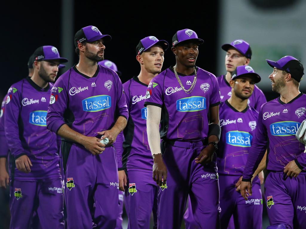 HOBART, AUSTRALIA — FEBRUARY 07: Matthew Wade of the Hurricanes leads Jofra Archer and Hurricanes players from the field after winning the Hurricanes v Renegades Big Bash League Match at Blundstone Arena on February 07, 2019 in Hobart, Australia. (Photo by Scott Barbour/Getty Images)