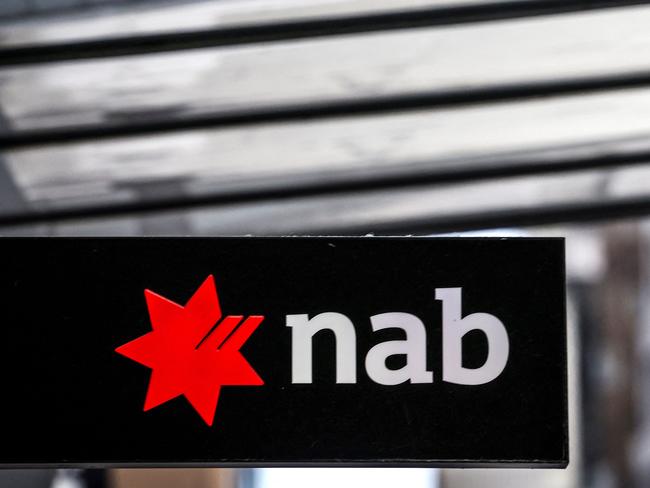 A sign displays the logo of National Australia Bank outside a branch in central Sydney on November 7, 2024. National Australia Bank released its full-year financial results for 2024 on November 7. (Photo by DAVID GRAY / AFP)