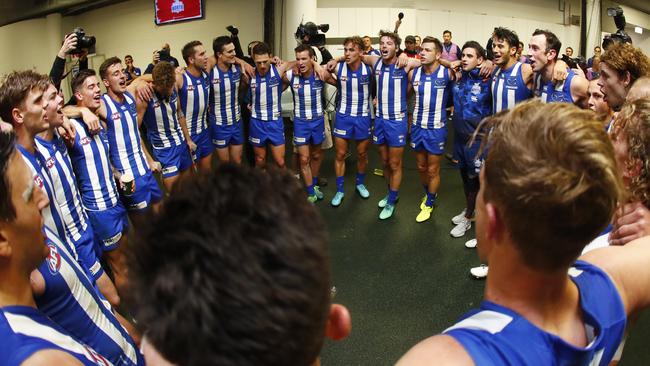 North Melbourne players celebrate the win over Sydney.