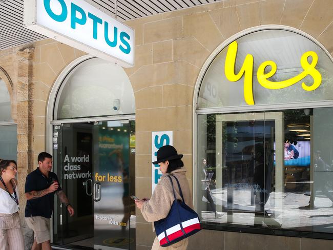 SYDNEY, AUSTRALIA: Newswire Photos- NOVEMBER 08 2023: People are seen walking past the Optus shop in North Sydney as they have a massive outage today across their network leaving thousands of customers and businesses without phone or internet service. Photo by: NCA Newswire /Gaye Gerard