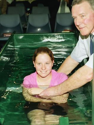 Gemma Edwards is baptised by Brother Bill Webber during a Jehovah’s Witness mass ceremony at Adelaide Convention Centre.