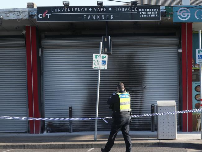 Police at the scene of a tobacco shop fire bombing in Fawkner. Picture: David Crosling