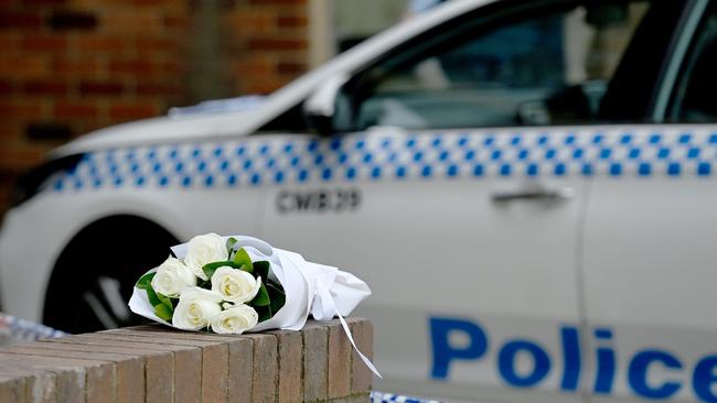 Flowers were left at the Merrylands apartment where Mrs Gilbert was killed. Picture: Jeremy Piper