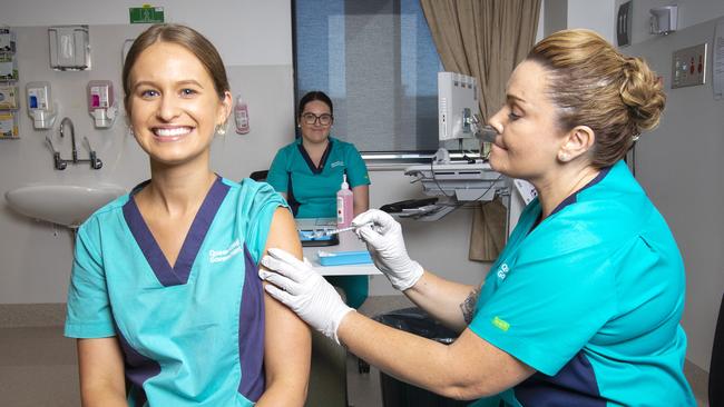 Registered Nurse Zoe Park gets the first COVID-19 jab from clinical nurse consultant Kellie Kenway. Picture: Nigel Hallett.