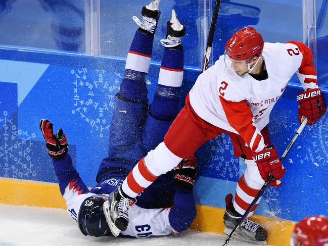 Slovakia’s Tomas Syrovy vies with Russia’s Artyom Zub (R) in the men’s preliminary round ice hockey match between Slovakia and Olympic Athletes from Russia during the Pyeongchang 2018 Winter Olympic Games at the Gangneung Hockey Centre in Gangneung on February 14, 2018. Picture AFP