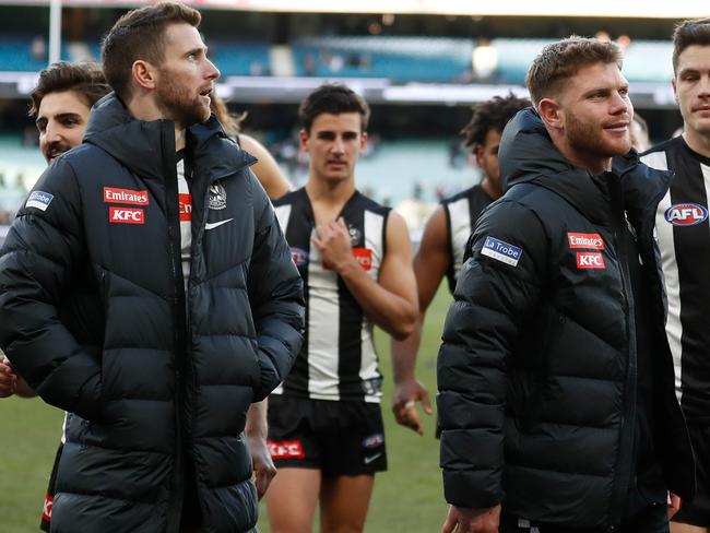 MELBOURNE, AUSTRALIA - JULY 30: Jeremy Howe (left) and Taylor Adams of the Magpies look on during the 2022 AFL Round 20 match between the Collingwood Magpies and the Port Adelaide Power at the Melbourne Cricket Ground on July 30, 2022 in Melbourne, Australia. (Photo by Michael Willson/AFL Photos via Getty Images)