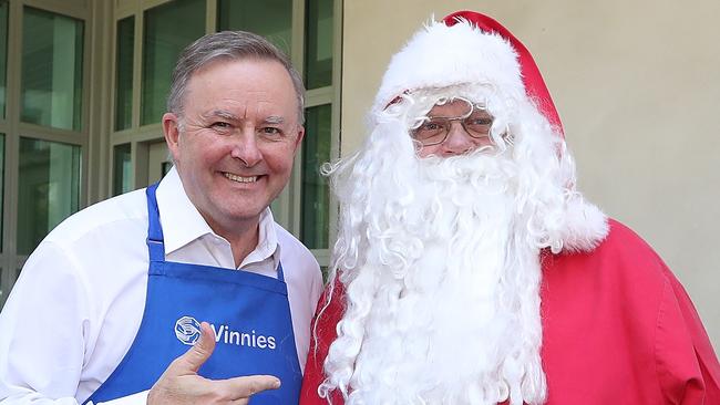 Anthony Albanese and Santa Claus at a Parliament House charity BBQ on Tuesday. Picture: Kym Smith