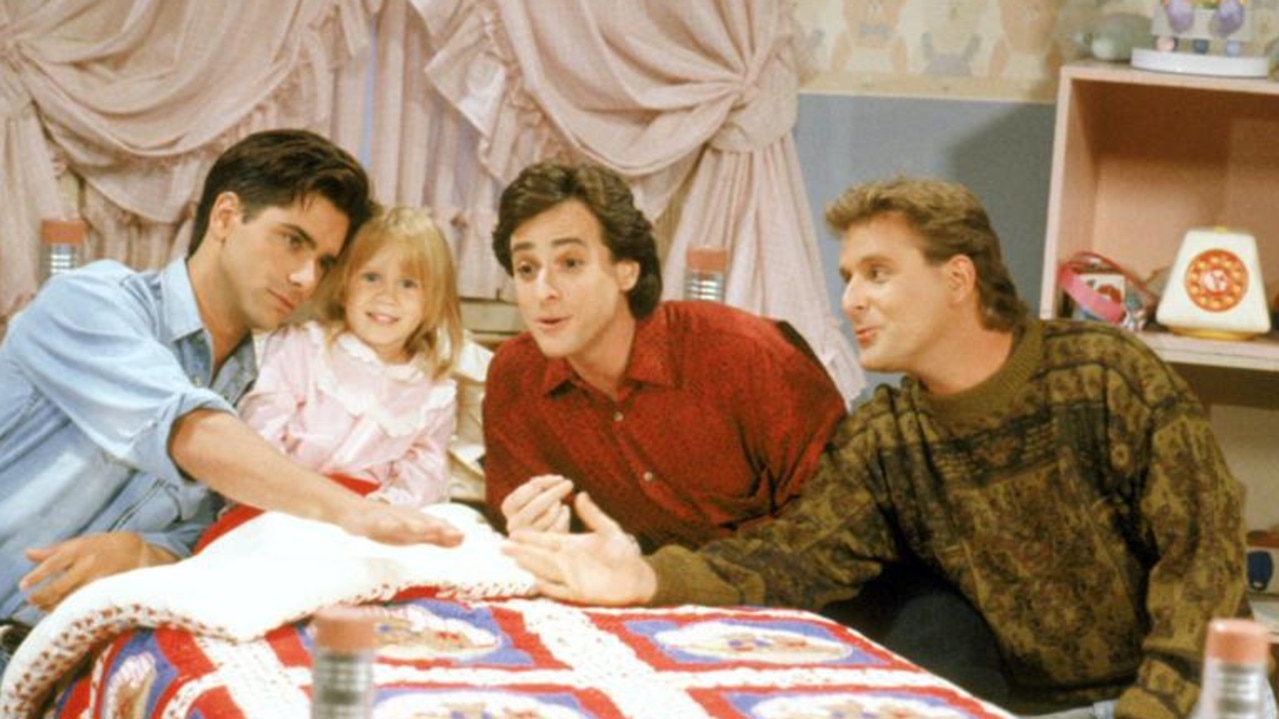 Bob Saget (red shirt) shot to fame in the ‘80s on the series Full House, alongside John Stamos, Mary Kate Ashley Olsen and Dave Coulier. Picture: Warner Bros. / Courtesy: Everett Collection