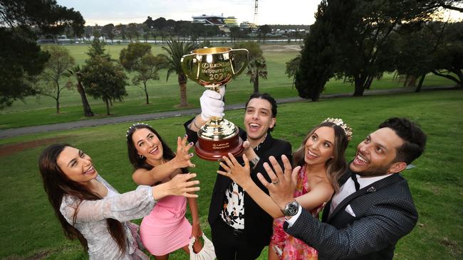 PeopleÃ&#149;s Cup. The Melbourne Cup is still the Holy Grail to young people. Spring carnival fans Marina Elias, Annabelle Riesz, Fabio Guergues, Bianca Markovic and Gareth Folkard with the Melbourne Cup. Picture: David Caird