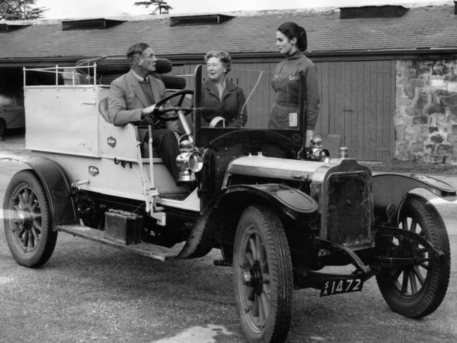 The famous 1908 Talbot motor car which made two trips from Adelaide to Darwin, in 1909 and again in 1959. At the wheel is Mr. John Dutton from the 1959 team, whose father made the pioneering trip of 50 years prior, with his wife (c) and Miss Jo Heysen, 06 Aug 1959.