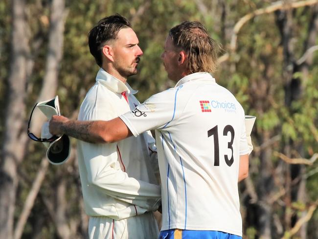 Southern Districts captain Matt Hammond shakes hands with Eagles skipper Jake Reed. Picture: Roz Lavercombe.