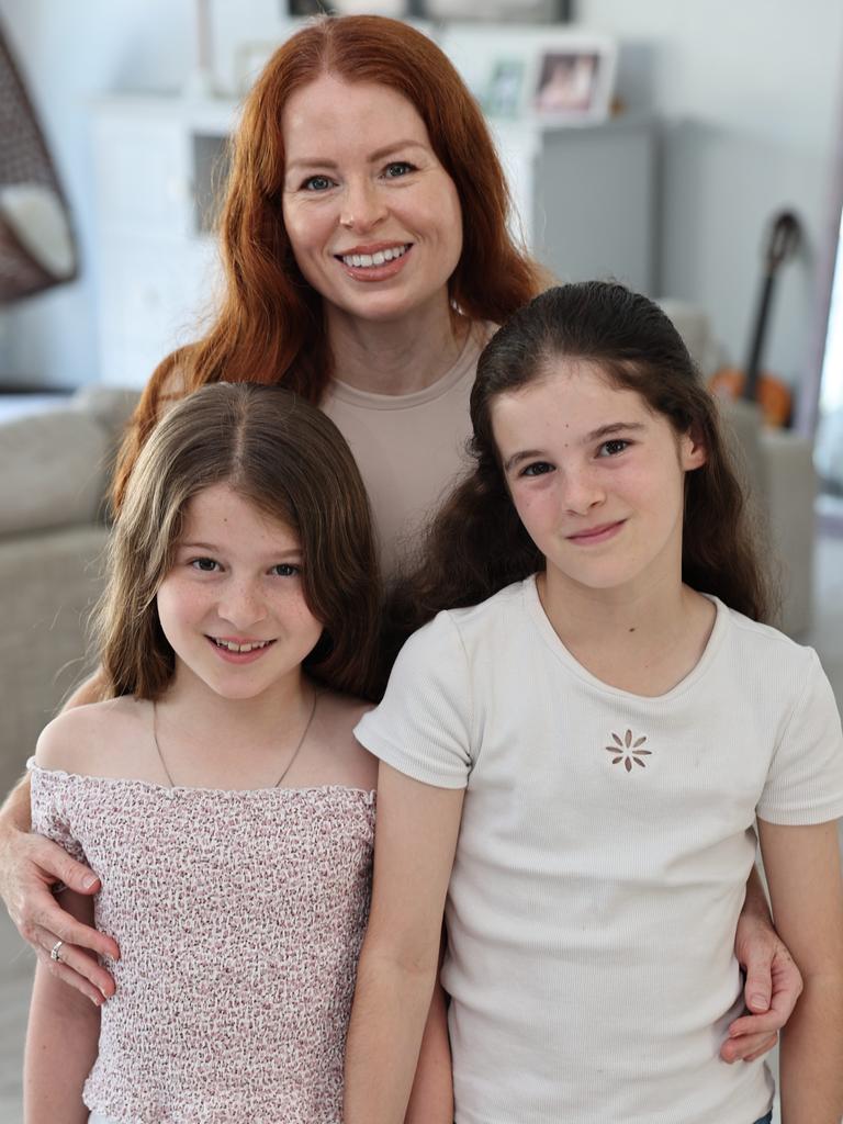 Regan Merka with her daughters Maddie, 8, and Lilly, 10, at their Broadbeach Waters home. Picture: Glenn Hampson.