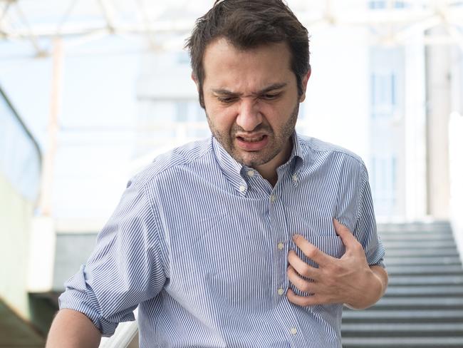 Man feeling a big pain on the chest and collapsing istock image.