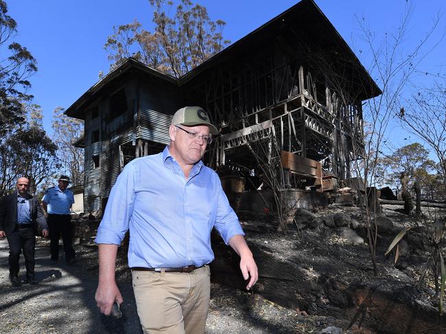 Australian Prime Minister Scott Morrison is seen during a visit to the bushfire affected area of Binna Burra in the Gold Coast Hinterland, Friday, September 13, 2019. Weather conditions have eased after severe bushfires claimed scores of homes in Queensland and New South Wales earlier this week. (AAP Image/Dave Hunt) NO ARCHIVING