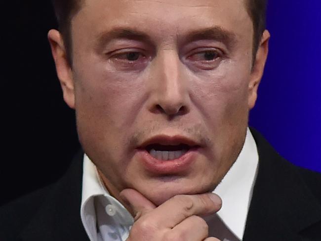 (FILES) In this file photo taken on September 29, 2017 Billionaire entrepreneur and founder of SpaceX Elon Musk speaks at the 68th International Astronautical Congress 2017 in Adelaide.  Bases on the moon and Mars could help preserve human civilization and hasten its regeneration on earth in the event of a third world war, billionaire entrepreneur Elon Musk, said on March 11, 2018. Musk, the founder of rocket and spacecraft company SpaceX, said the company's interplanetary ship could begin test flights as soon as next year. There is "some probability" that there will be another Dark Ages, "particularly if there is a third world war," Musk said at the SXSW conference.  / AFP PHOTO / PETER PARKS