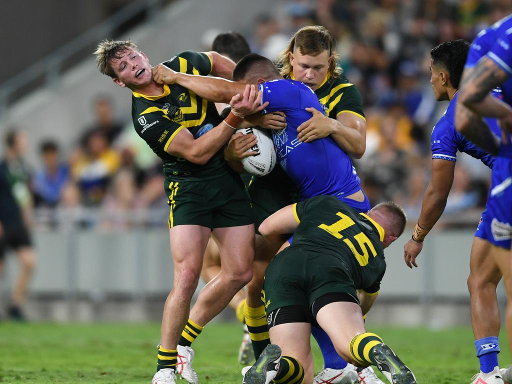 Gordon Chan Kum Tong is wrapped up by the Kangaroos. Picture: NRL Images