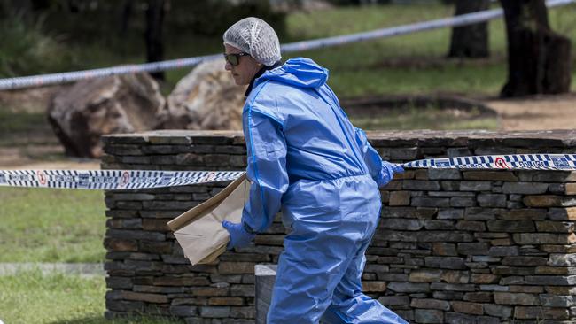 Queensland Police and Forensic Services officers attend the scene of a shooting in the suburb of Wakerley where Liam Scorsese was shot by police and died soon after. (AAP Image/Glenn Hunt)