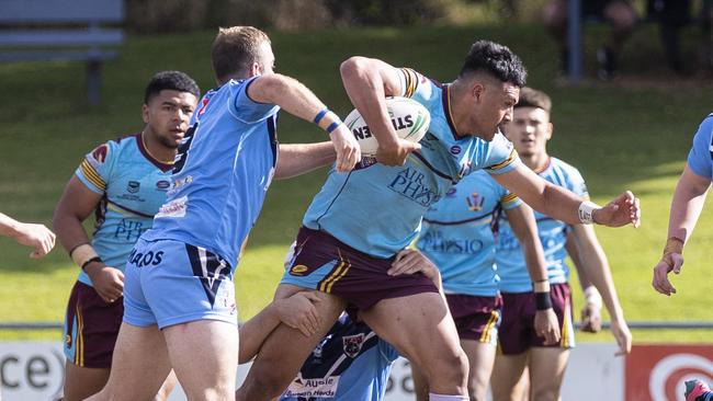 Taj Harris (13)) forcing his way through the defence of Mary Mount College. Keebra Park Vs. Marymount College