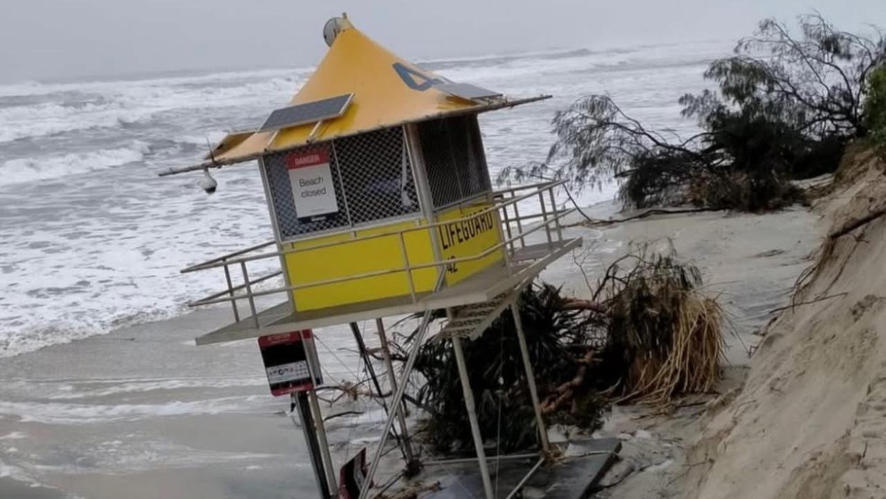 Beaches on brink: Lifeguard tower on edge of eroded sand cliff