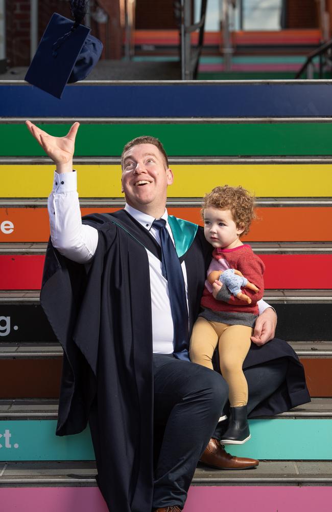 Simon Moore with his daughter Elodie, 2, has graduated from Deakin University with a Bachelor of Nursing Distinction. Picture: Brad Fleet