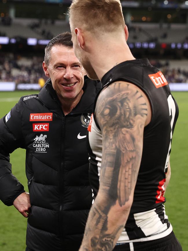 Craig Macrae, senior coach of the Magpies talks with Jordan De Goey. Photo by Michael Klein.