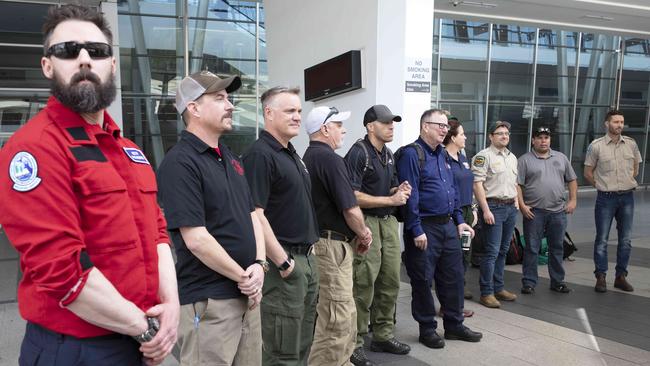 US and Canadian aviation specialists are welcomed to Adelaide Airport on Sunday before they begin their firefighting work. Picture: AAP.