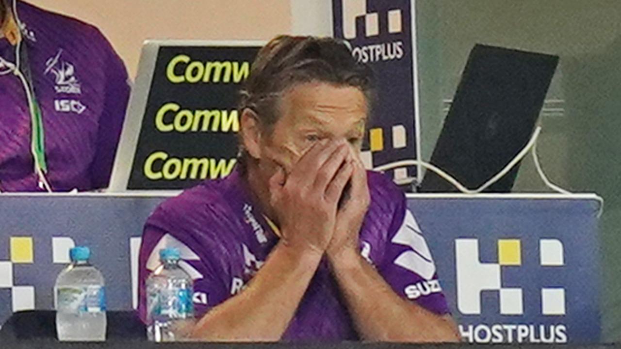 Craig Bellamy, coach of the Melbourne Storm reacts in the coaches box after a Raiders try