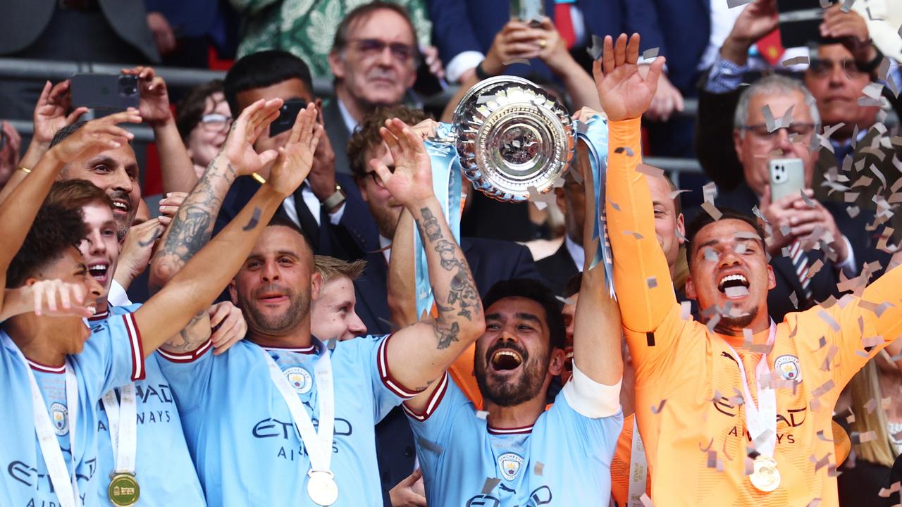 LONDON, ENGLAND – JUNE 03: Ilkay Guendogan of Manchester City lifts the FA Cup Trophy after the team's victory during the Emirates FA Cup Final between Manchester City and Manchester United at Wembley Stadium on June 03, 2023 in London, England. (Photo by Clive Rose/Getty Images)