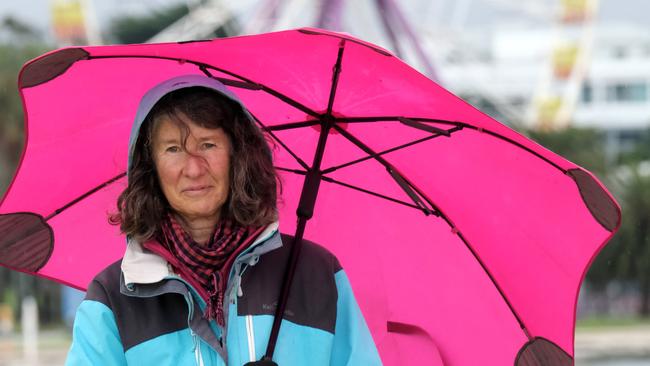 Barbara Gault with an umbrella on Sunday at Eastern Beach. Picture: Mark Wilson