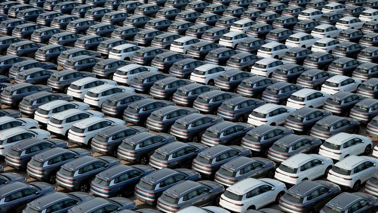 BYD electric cars for export waiting to be loaded onto a ship at a port in Yantai, in eastern China's Shandong province. Picture by AFP) / China OUT