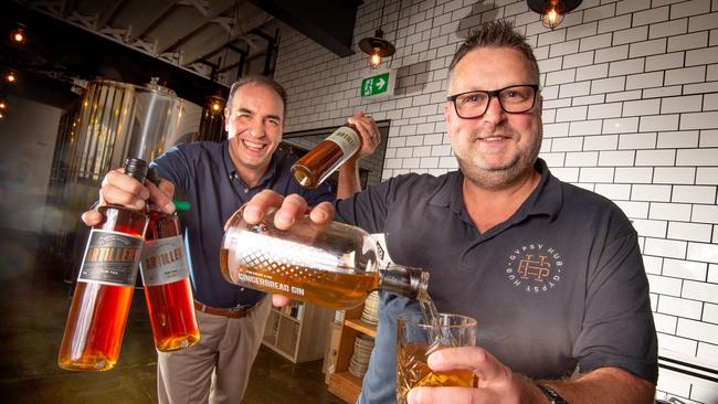 The Craft &amp; Co at Smith St, Collingwood, is closed. Anthony Palmer and owner Paul Baggio with the micro-distillery’s Gingerbread Gin. Picture: Tony Gough.