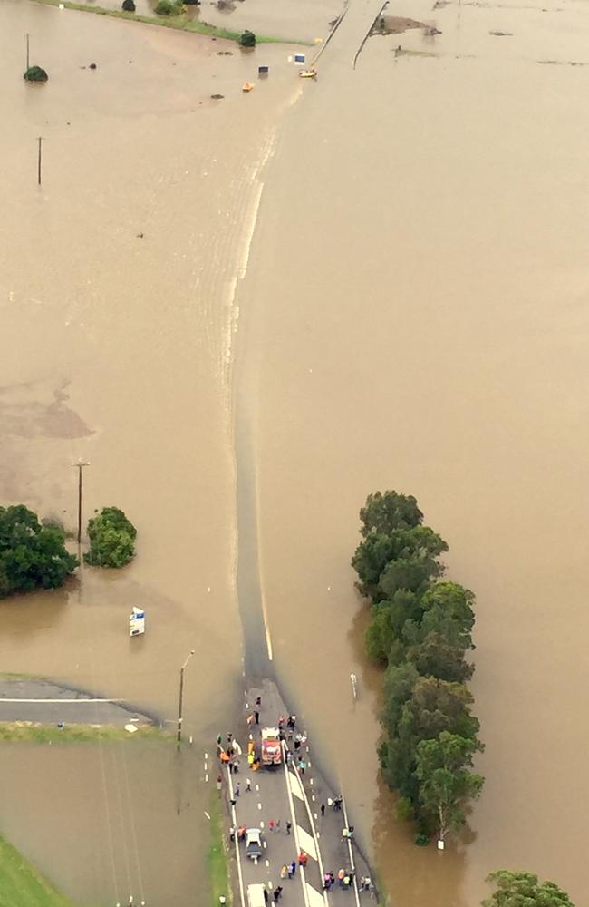 Flooding in Maitland near where a car was submerged in floodwaters. Picture: Neil Keene