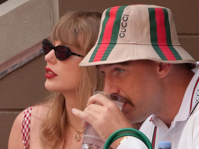 US musician Taylor Swift and US NFL football player Travis Kelce attend the men's final match between Italy's Jannik Sinner and USA's Taylor Fritz on day fourteen of the US Open tennis tournament at the USTA Billie Jean King National Tennis Center in New York City, on September 8, 2024. (Photo by TIMOTHY A. CLARY / AFP)