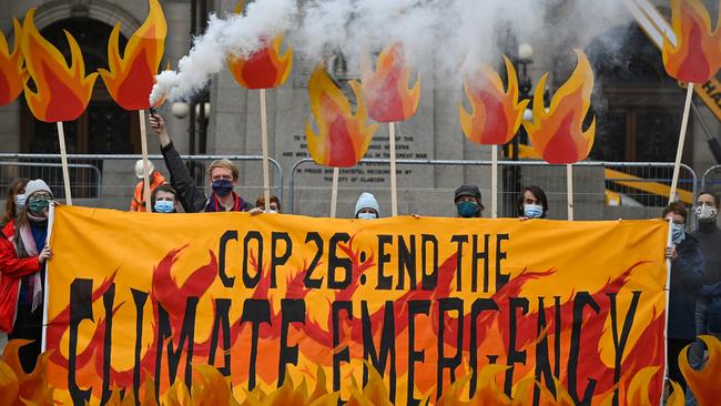 Activists prepare to welcome world leaders to Glasgow with a field of climate fire. Picture: Getty Images