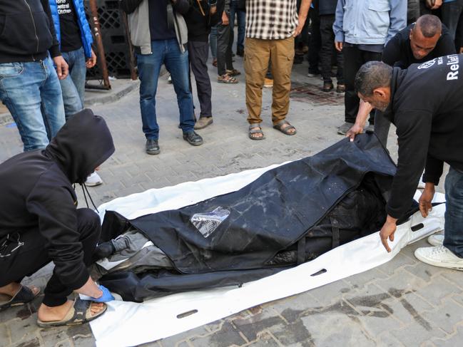 People look emotional as they receive the bodies of World Central Kitchen workers who were killed by Israeli air strikes on April 02, 2024 in Rafah, Gaza. Picture: Ahmad Hasaballah/Getty Images