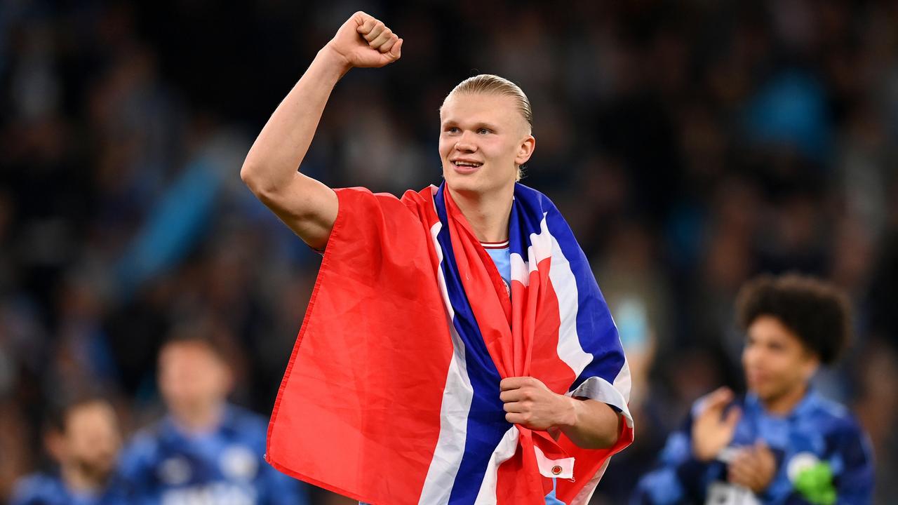 MANCHESTER, ENGLAND - MAY 17: Erling Haaland of Manchester City celebrates with the Norwegian flag after the team's victory during the UEFA Champions League semi-final second leg match between Manchester City FC and Real Madrid at Etihad Stadium on May 17, 2023 in Manchester, England. (Photo by Michael Regan/Getty Images)