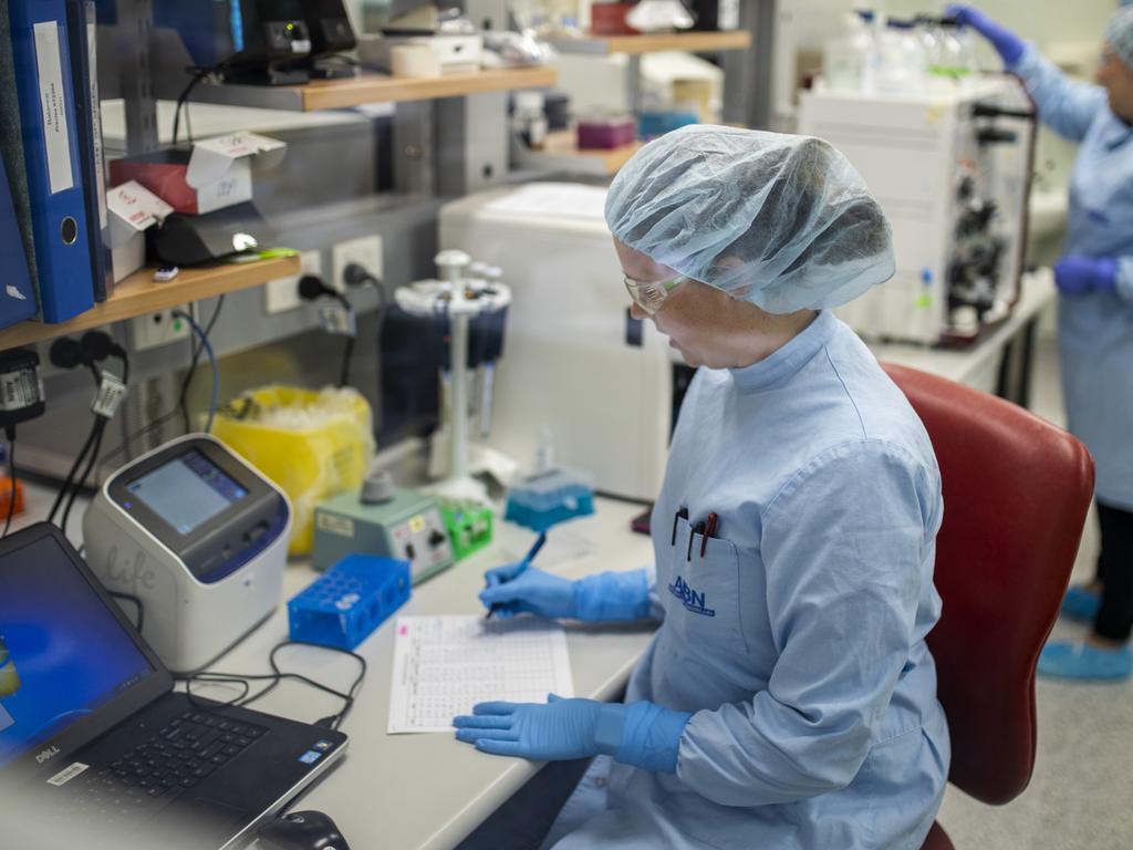 Queensland University scientists working in the lab on a coronavirus vaccine