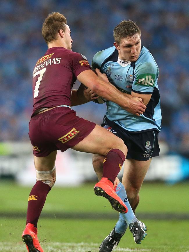 Ryan Hoffman runs at Daly Cherry-Evans last year.