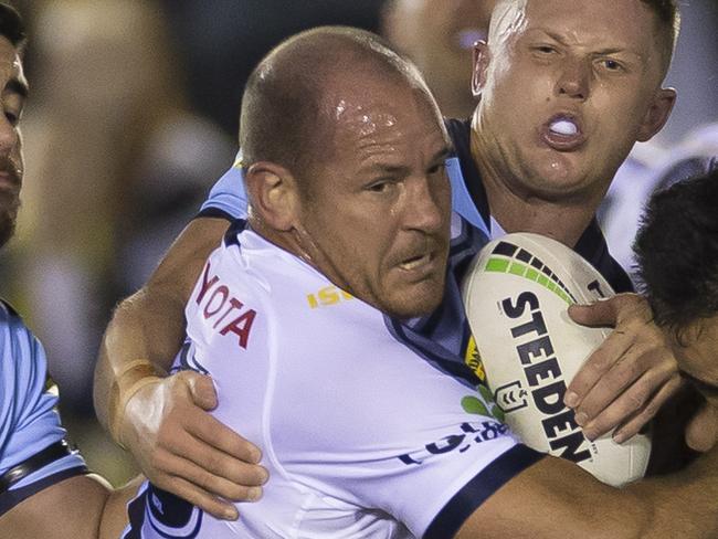 Matthew Scott of the Cowboys is tackled during the Round 19 NRL match between the Cronulla Sharks and the North Queensland Cowboys at Pointsbet Stadium in Sydney, Thursday, July 25, 2019. (AAP Image/Craig Golding) NO ARCHIVING, EDITORIAL USE ONLY