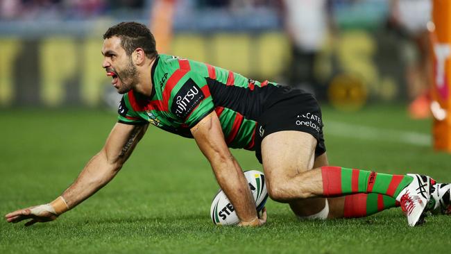 Greg Inglis of the Rabbitohs celebrates after scoring a try.